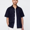 Camisa de popelina con ojales