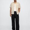 Camisa de popelina con ojales