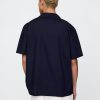 Camisa de popelina con ojales
