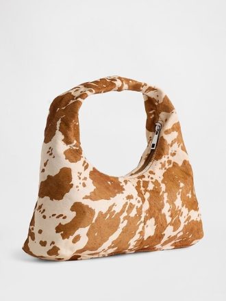 Mini bolso holgado de pelo de becerro con estampado de vaca