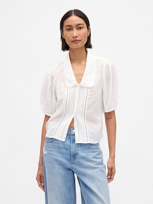 Top con cuello y mangas abullonadas Top con cuello y mangas abullonadas