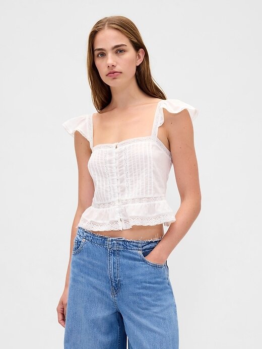 Top corto con peplum de gasa y volantes de encaje Top corto con peplum de gasa y volantes de encaje