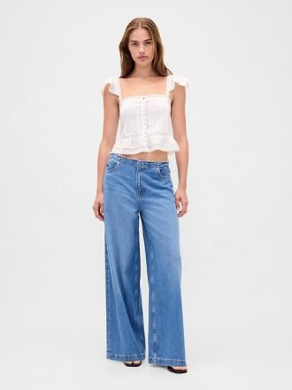 Top corto con peplum de gasa y volantes de encaje