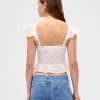Top corto con peplum de gasa y volantes de encaje Top corto con peplum de gasa y volantes de encaje