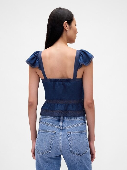 Top corto con peplum de gasa y volantes de encaje Top corto con peplum de gasa y volantes de encaje