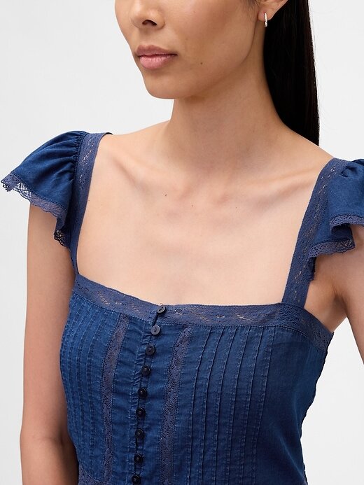 Top corto con peplum de gasa y volantes de encaje Top corto con peplum de gasa y volantes de encaje