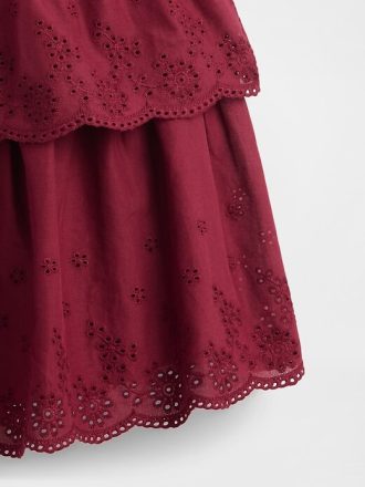Vestido infantil con ojales en técnica mixta